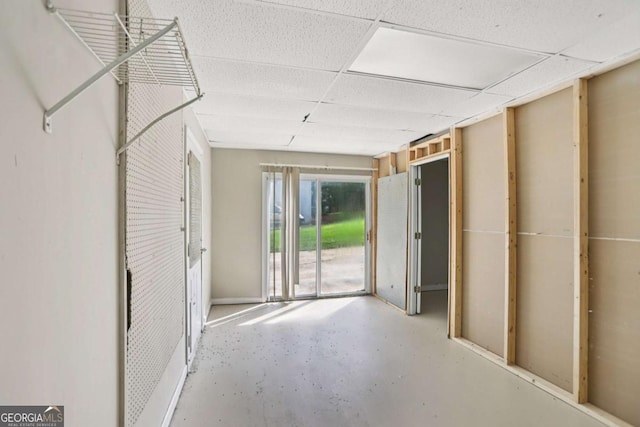 73 Azalea Dr, Villa Rica, GA 30180 - empty room with concrete flooring and a paneled ceiling