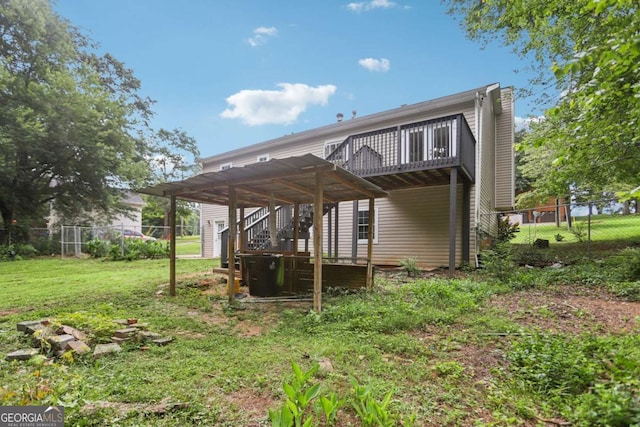 73 Azalea Dr, Villa Rica, GA 30180 - rear view of house with a wooden deck, a fenced backyard, and stairs