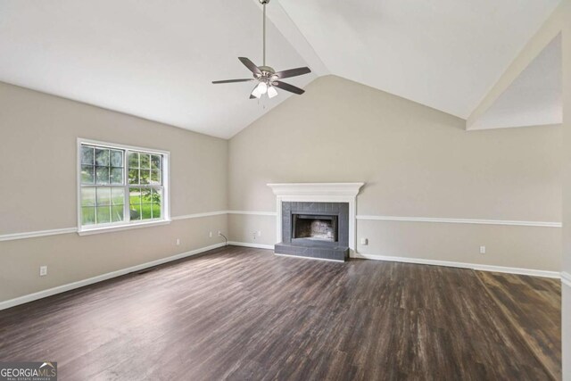 73 Azalea Dr, Villa Rica, GA 30180 - unfurnished living room with ceiling fan, lofted ceiling, wood finished floors, and a tiled fireplace