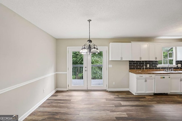 73 Azalea Dr, Villa Rica, GA 30180 - kitchen featuring dishwasher, a textured ceiling, backsplash, white cabinetry, and dark wood-type flooring