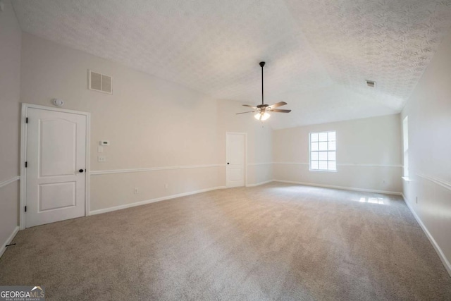 4815 Price St, Forest Park, GA 30297 - spare room with ceiling fan, lofted ceiling, carpet floors, and a textured ceiling
