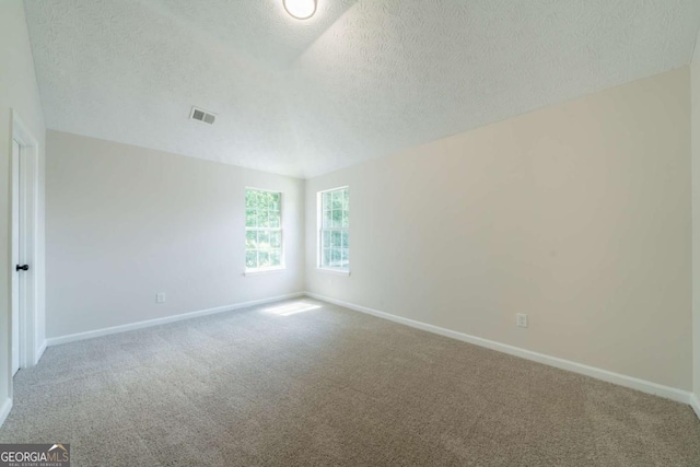 4815 Price St, Forest Park, GA 30297 - empty room featuring a textured ceiling and carpet flooring
