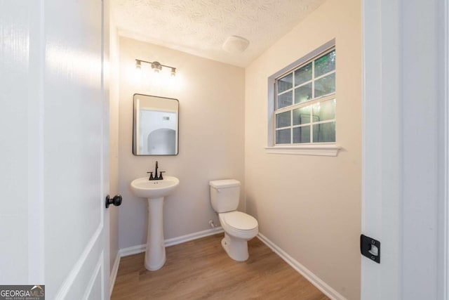 4815 Price St, Forest Park, GA 30297 - bathroom with wood finished floors and a textured ceiling
