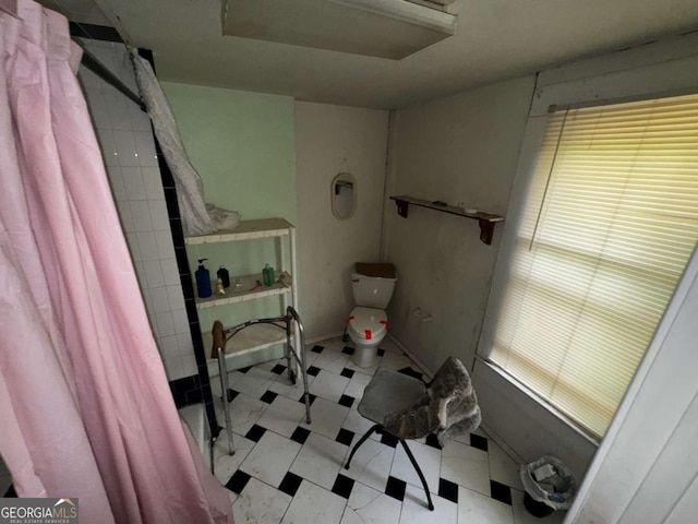 6733 Old Covington Rd, Lithonia, GA 30058 - full bathroom with tile patterned floors and tiled shower