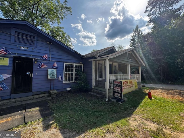 6733 Old Covington Rd, Lithonia, GA 30058 - view of front of home featuring a porch