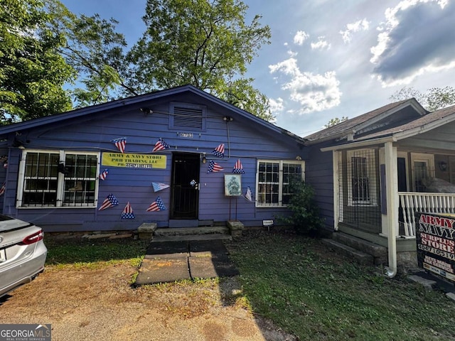 6733 Old Covington Rd, Lithonia, GA 30058 - view of front of house featuring covered porch