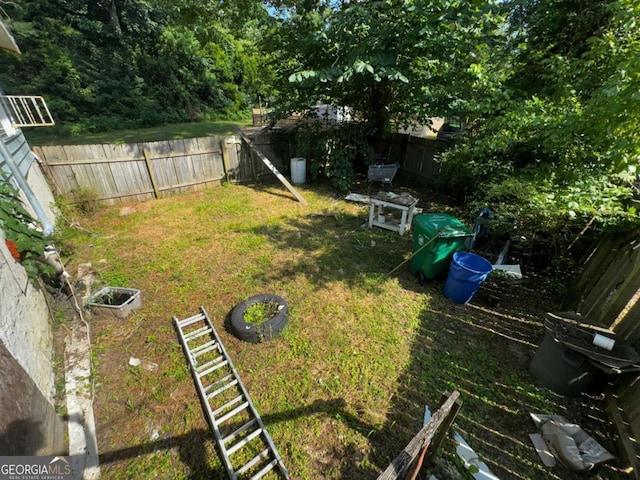 6733 Old Covington Rd, Lithonia, GA 30058 - fenced backyard featuring a garden