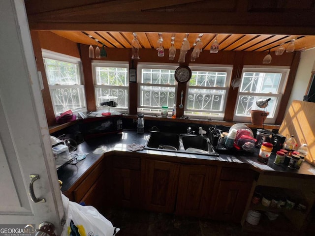 6733 Old Covington Rd, Lithonia, GA 30058 - kitchen featuring a sink and a wooden ceiling with exposed beams