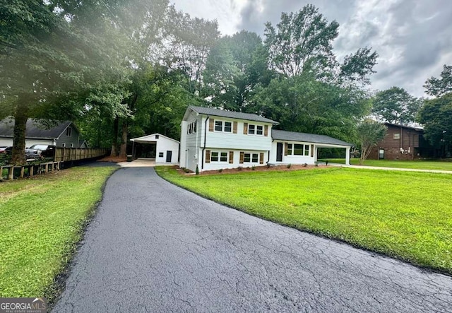 309 Morning Star Ln, Mount Airy, GA 30563 - tri-level home with a carport, asphalt driveway, and view of wooded area