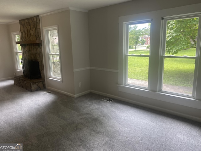 212 Rockmart Rd, Villa Rica, GA 30180 - unfurnished living room featuring carpet flooring, plenty of natural light, a fireplace, and ornamental molding