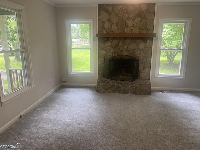 212 Rockmart Rd, Villa Rica, GA 30180 - unfurnished living room with carpet flooring, a fireplace, plenty of natural light, and ornamental molding