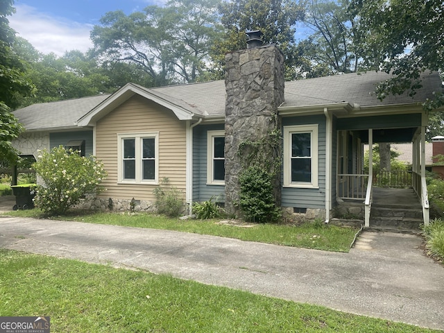 212 Rockmart Rd, Villa Rica, GA 30180 - view of front of home featuring a chimney, crawl space, roof with shingles, and covered porch