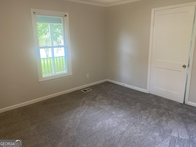 212 Rockmart Rd, Villa Rica, GA 30180 - spare room featuring crown molding and dark colored carpet