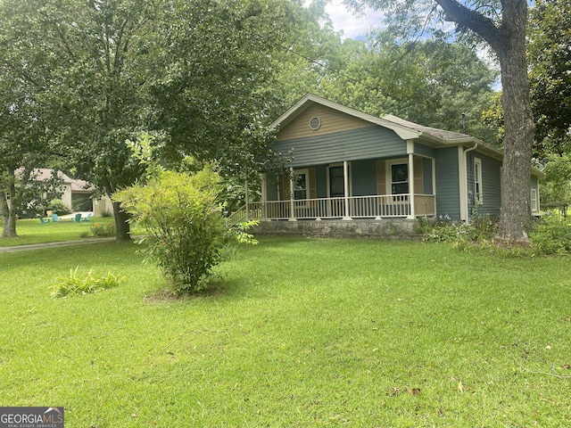 212 Rockmart Rd, Villa Rica, GA 30180 - view of front of house featuring covered porch and a front lawn