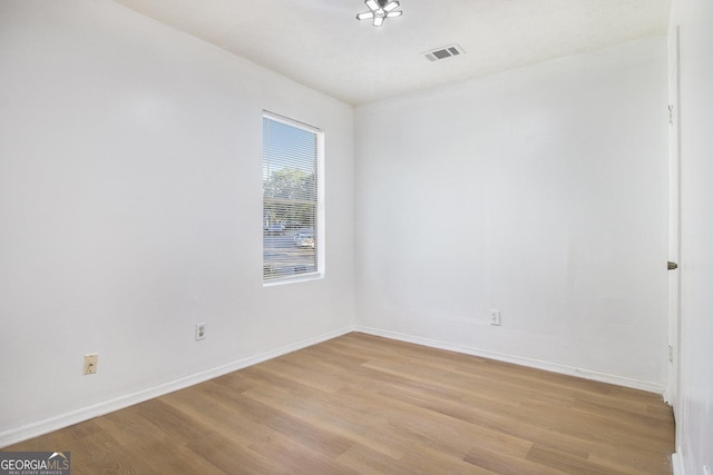 1077 Mainstreet Valley Dr, Stone Mountain, GA 30088 - spare room featuring light wood finished floors and baseboards