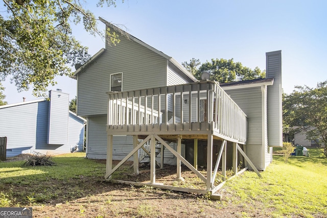 1077 Mainstreet Valley Dr, Stone Mountain, GA 30088 - back of house with a deck, a yard, and a chimney