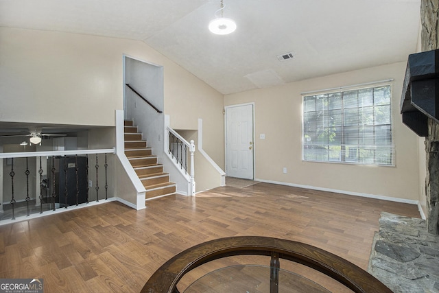 1077 Mainstreet Valley Dr, Stone Mountain, GA 30088 - entrance foyer with wood finished floors, lofted ceiling, stairway, and ceiling fan
