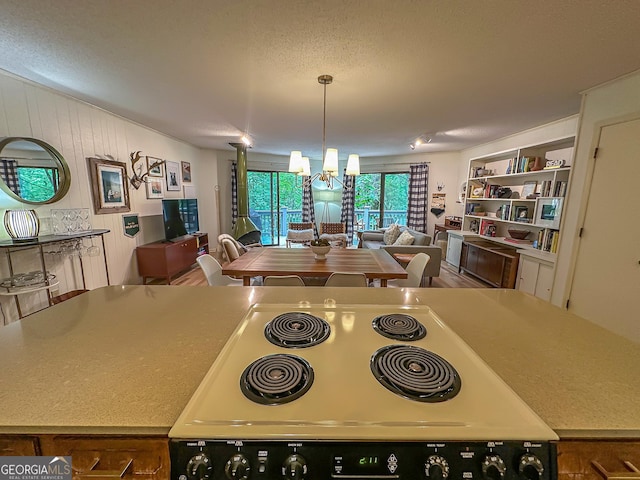 278 W Sugarbush Dr, Dillard, GA 30537 - dining room featuring a chandelier and a textured ceiling