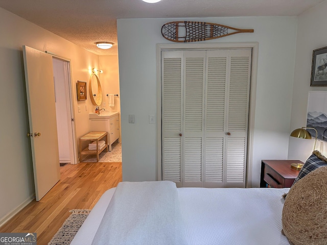278 W Sugarbush Dr, Dillard, GA 30537 - bedroom with light wood-type flooring and a closet