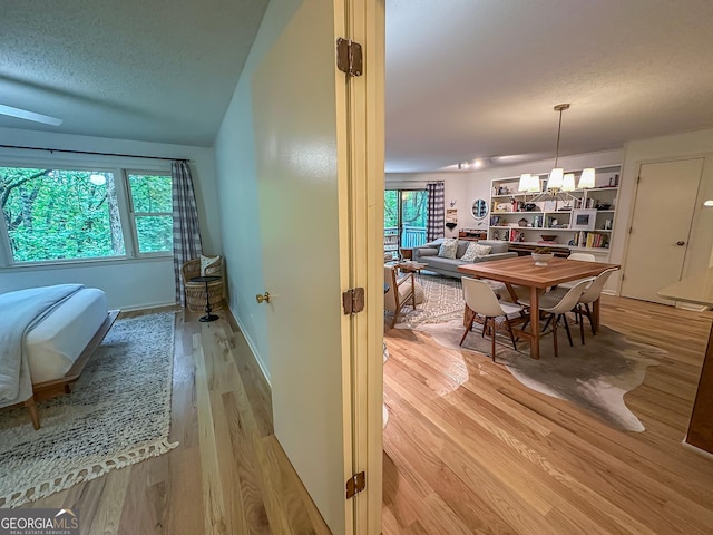278 W Sugarbush Dr, Dillard, GA 30537 - corridor with wood finished floors and a textured ceiling