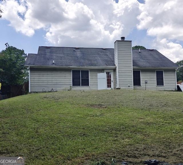 20 Bacchus Dr, Lawrenceville, GA 30045 - back of house featuring a lawn and a chimney