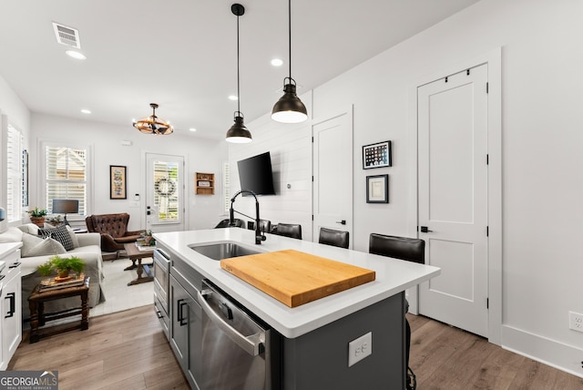 306 Clarendon Ct SE, Gainesville, GA 30501 - kitchen featuring stainless steel dishwasher, light wood-type flooring, light countertops, and recessed lighting