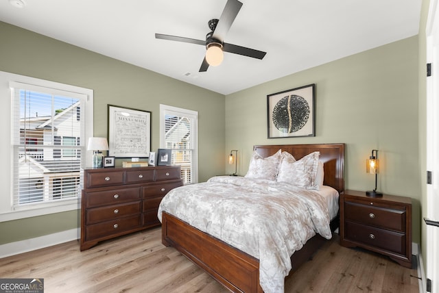 306 Clarendon Ct SE, Gainesville, GA 30501 - bedroom featuring light wood-style floors, multiple windows, and ceiling fan