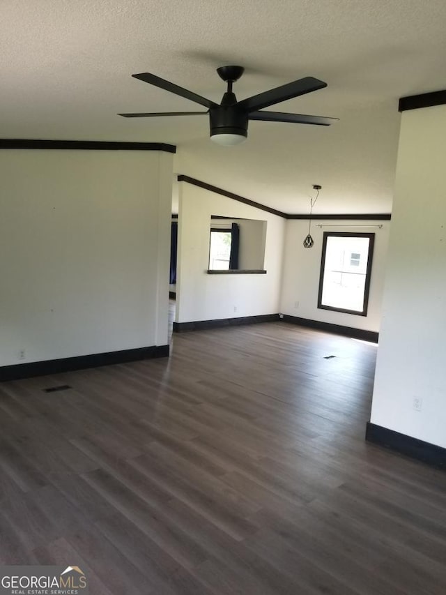 243 Gray Hill Rd, West Point, GA 31833 - spare room featuring a ceiling fan, dark wood-type flooring, and a textured ceiling