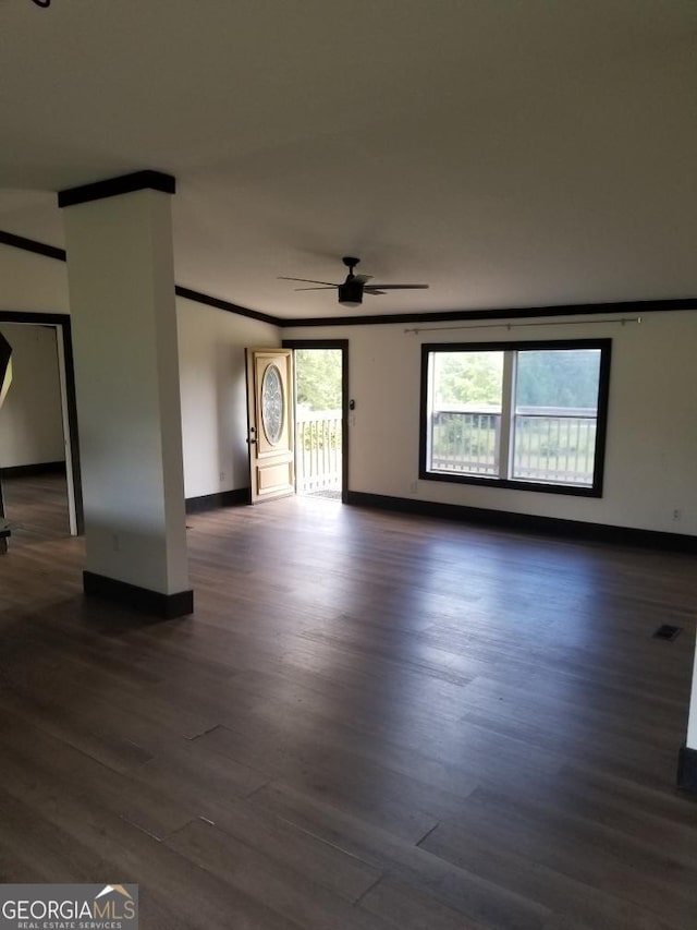 243 Gray Hill Rd, West Point, GA 31833 - unfurnished living room with a ceiling fan, dark wood-style flooring, and ornamental molding