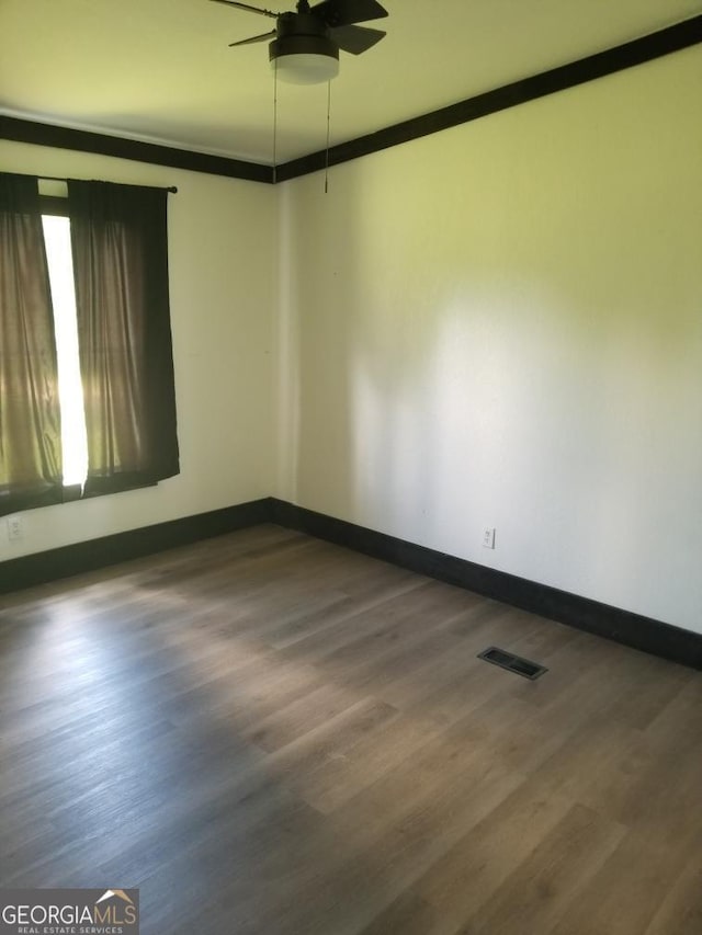 243 Gray Hill Rd, West Point, GA 31833 - unfurnished room featuring a ceiling fan, wood finished floors, and ornamental molding