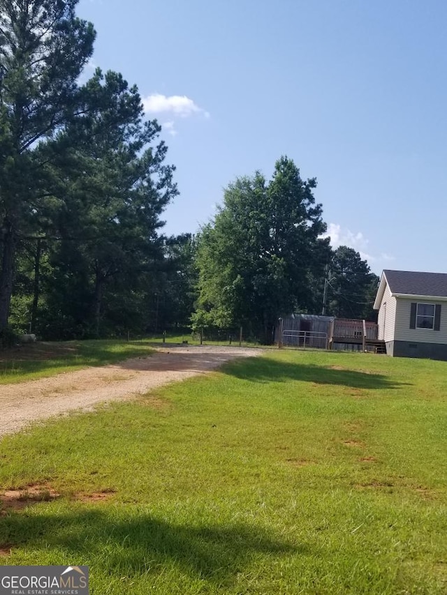 243 Gray Hill Rd, West Point, GA 31833 - view of green lawn featuring driveway