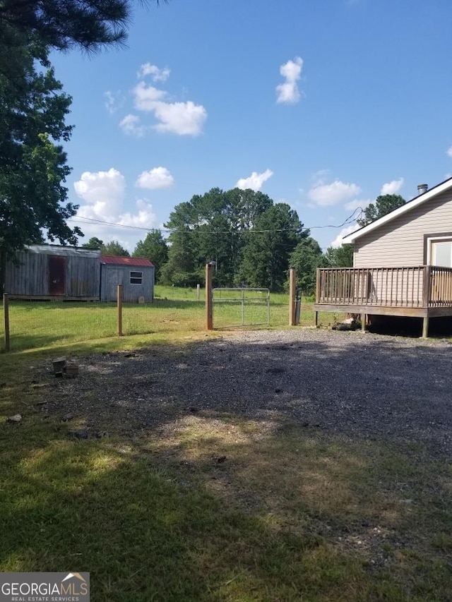 243 Gray Hill Rd, West Point, GA 31833 - view of green lawn with a wooden deck