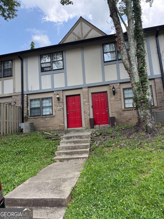 1150 Rankin St Unit O5, Stone Mountain, GA 30083 - view of front of home with brick siding and stucco siding