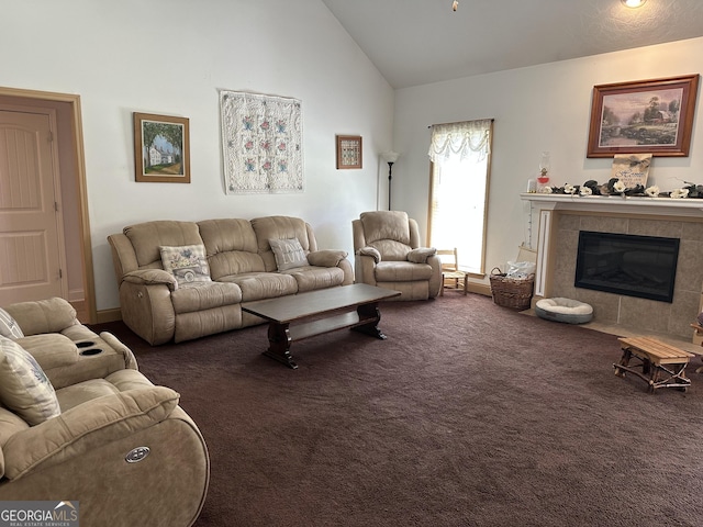 722 Gumlog Rd, Wrightsville, GA 31096 - carpeted living room featuring a tiled fireplace and high vaulted ceiling