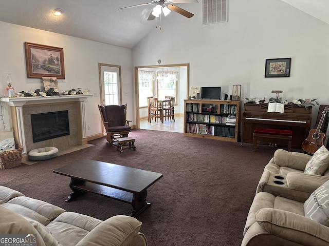 722 Gumlog Rd, Wrightsville, GA 31096 - carpeted living room with a ceiling fan, high vaulted ceiling, and a fireplace