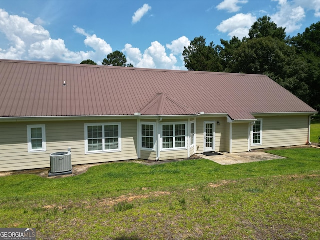 722 Gumlog Rd, Wrightsville, GA 31096 - rear view of property featuring a patio area, a metal roof, and a yard