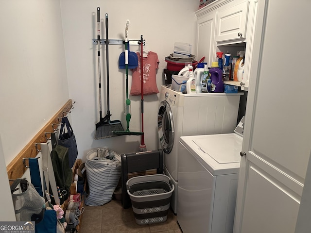 722 Gumlog Rd, Wrightsville, GA 31096 - laundry area featuring cabinet space, washer and dryer, and tile patterned floors