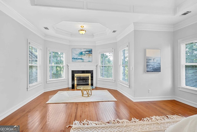 4030 Greatwood Path, Alpharetta, GA 30005 - unfurnished living room featuring hardwood / wood-style floors, a tile fireplace, and crown molding