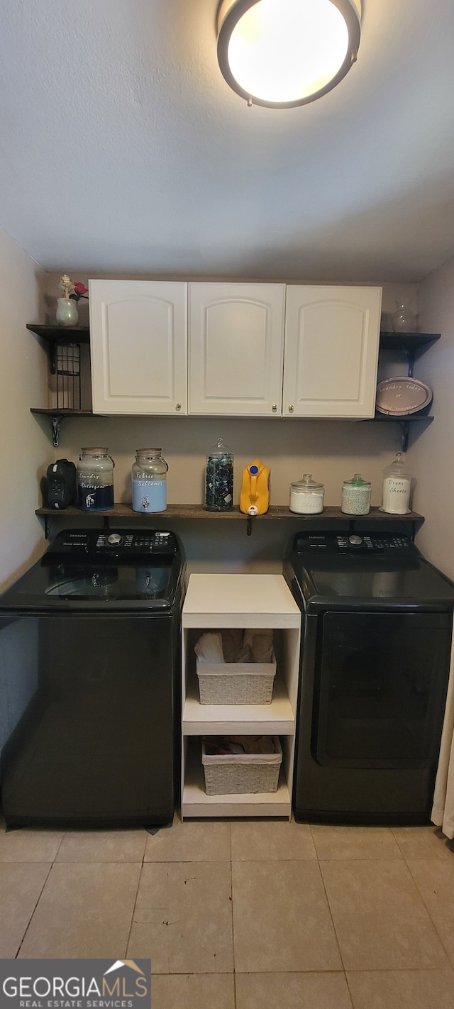 1605 Cody Rd, Mount Airy, GA 30563 - kitchen featuring washing machine and clothes dryer, open shelves, white cabinetry, and dark countertops