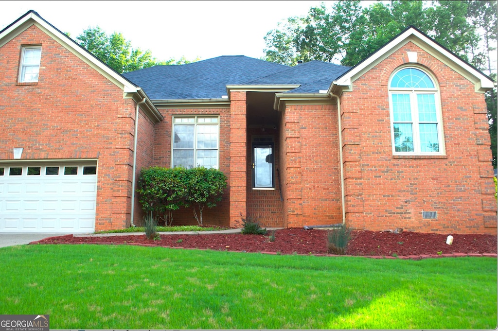 122 Carolinas Way, Fayetteville, GA 30215 - view of front of property with a front yard, roof with shingles, and brick siding