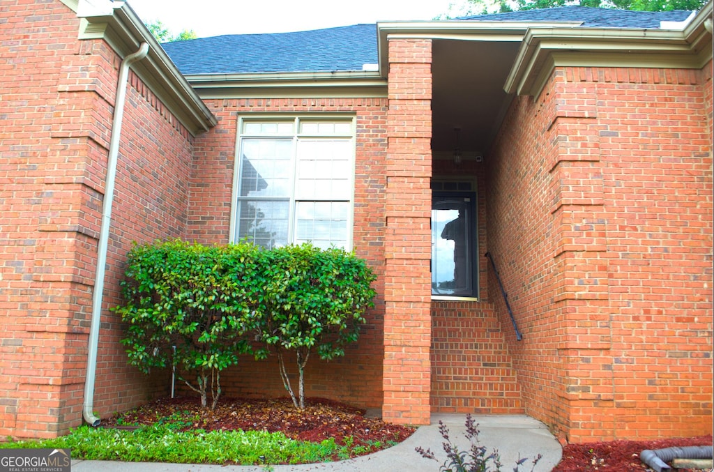 122 Carolinas Way, Fayetteville, GA 30215 - entrance to property with a shingled roof and brick siding