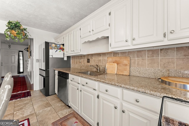 625 Hickory Nobb, Sugar Hill, GA 30518 - kitchen featuring stainless steel appliances, white cabinets, backsplash, light stone countertops, and a textured ceiling