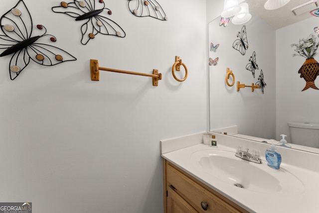 625 Hickory Nobb, Sugar Hill, GA 30518 - bathroom featuring vanity and toilet
