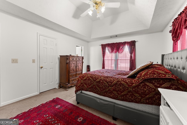 625 Hickory Nobb, Sugar Hill, GA 30518 - bedroom with light carpet, a ceiling fan, and a tray ceiling