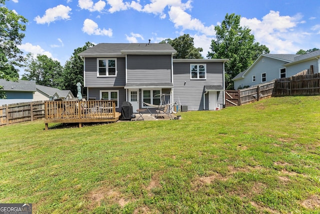 625 Hickory Nobb, Sugar Hill, GA 30518 - rear view of property featuring a fenced backyard, a wooden deck, and a sunroom