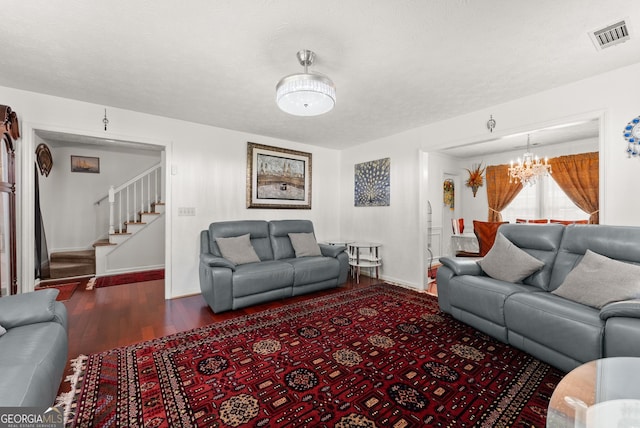 625 Hickory Nobb, Sugar Hill, GA 30518 - living room featuring wood finished floors, stairs, and a chandelier