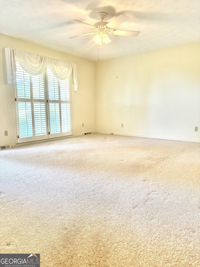 10 Montre Cir SE, Silver Creek, GA 30173 - carpeted spare room with a ceiling fan and a textured ceiling