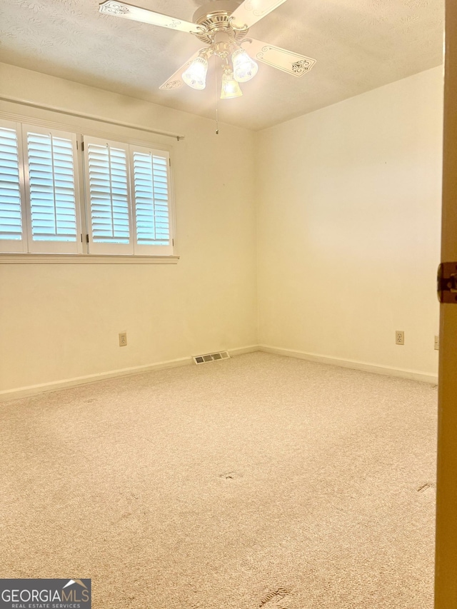 10 Montre Cir SE, Silver Creek, GA 30173 - carpeted empty room with baseboards and a ceiling fan