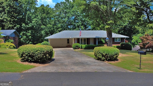 10 Montre Cir SE, Silver Creek, GA 30173 - single story home featuring asphalt driveway, a front yard, and an attached carport
