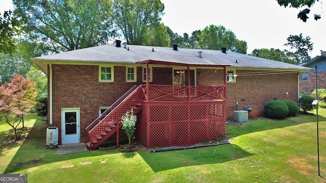 10 Montre Cir SE, Silver Creek, GA 30173 - back of house featuring brick siding, a lawn, and stairway
